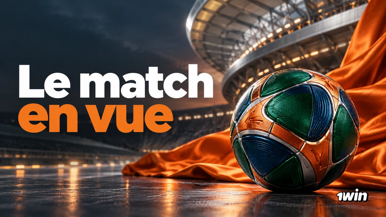 Ballon vert et orange dans un stade sombre éclairé